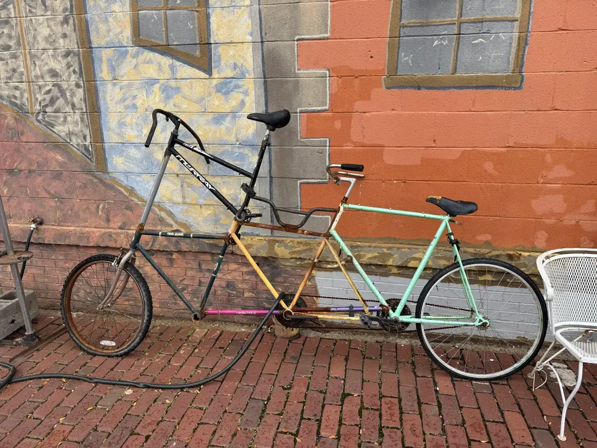 Tandem tall bike assembled from many frames